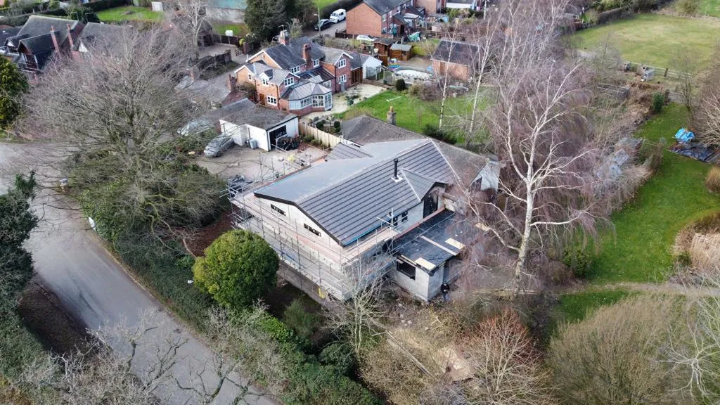 an aerial view of a house in a residential area